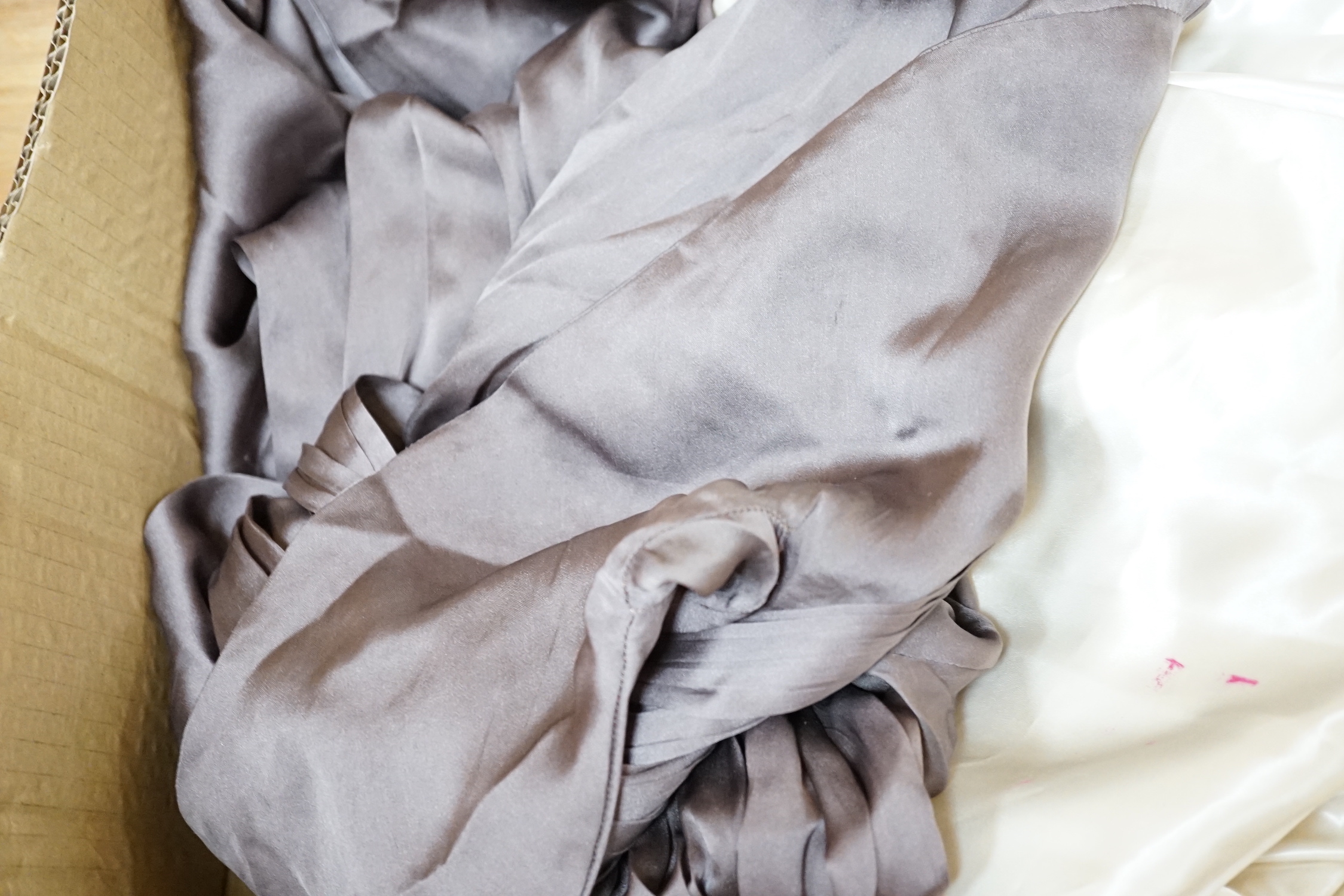A white satin halter neck 1950's evening dress and a fine silk hand sewn day dress